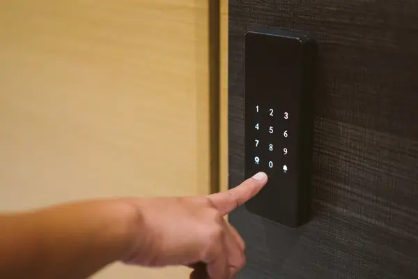a person pressing a button on a elevator