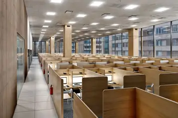 a room with cubicles and desks