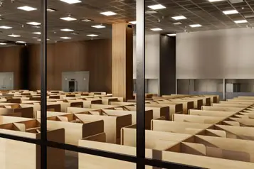 a room with many empty cubicles