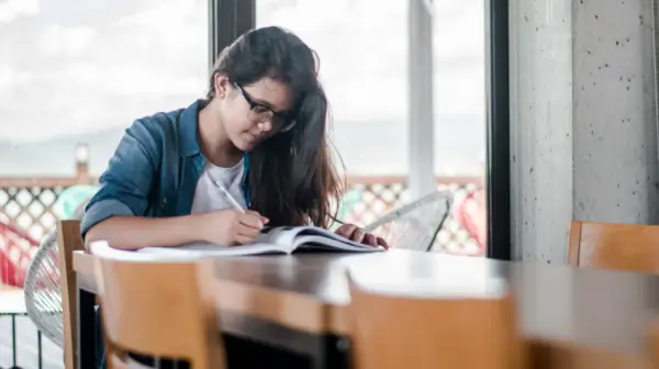 girl with long hair studying